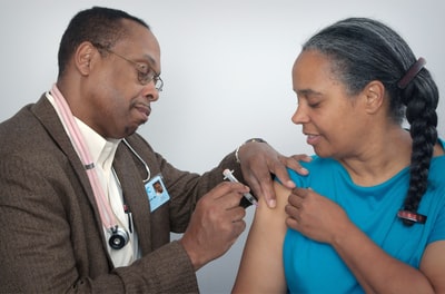 Man woman in the blue shirt for syringe injection
